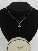 Links of London; a HM silver heart shaped pendant having links of London mark upon,