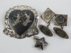 A small collection of silver niello jewellery being cufflinks, brooch and pendant.