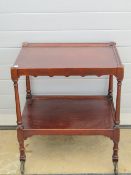 An Edwardian mahogany two tier tea trolley, 63 x 45cm, 72cm high, on wheels.