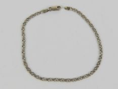 A 9ct white gold faceted panel bracelet, hallmarked 375, 18.5cm in length, 2.5g.