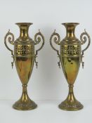 A pair of art nouveau tall brass urn style vases each marked C & K Co Tiel Holland 1378 to base.