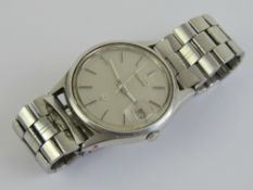 A Seiko wristwatch having grey dial, date aperture, marked Japan 6922-700L R, stainless steel back.