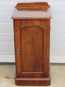 A single Victorian mahogany pot cupboard, door opening to reveal shelved compartment within,