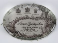 A contemporary James Purdy & Sons oval glass paperweight, 10cm wide.