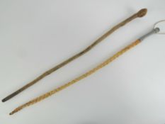 Two riding crops, a short plain stick crop, 28