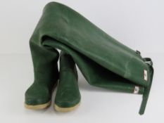 A pair of green rubber coarse fishing individual waders with belt straps, size 8.