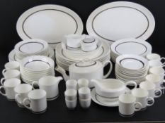 A large Susie Cooper Design dinner service made by Wedgwood including serving plates, dinner plates,