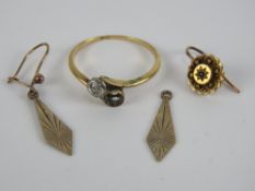 An 18ct gold and diamond two stone ring (one stone deficient), diamond approx 0.2ct, 2.