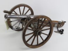 A deactivated table top 12 bore muzzle loading cannon and gun carriage, overall length approx 70cm,