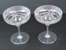 A pair of Art Deco silver overlaid glass champagne saucers, standing 11.5cm high.