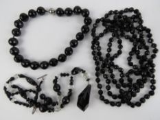 A c1920s French Jet faceted black glass bead flapper long necklace,