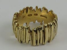 An 18ct gold abstract ring, hallmarked London, size P, 14.
