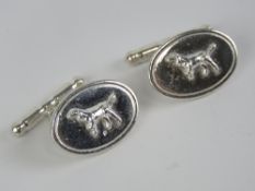 A pair of silver cufflinks having hunting dogs upon, stamped 925.