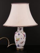 An Oriental export hand coloured baluster shaped vase decorated with butterflies upon,