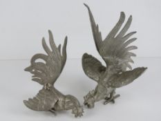 A pair of silver plated fighting cocks table decorations, each measuring approx 13cm in length.