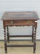 A Victorian Carolean revival frieze table with single drawer raised over barley twist supports,