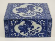 A late 19th / early 20th century opium den ceramic pillow of typical brick form with coin style