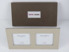 A Byron & Brown boxed fine leather double photograph frame for twin 10 x 9cm photos, 'as new'.