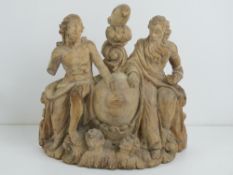 A carved wooden figurine of two Classical male figures, 19cm wide.