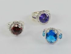 Four cocktail rings each stamped 925, size K-N.