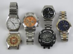 Three stainless steel Lorus wristwatches each having day and date apertures to dial.