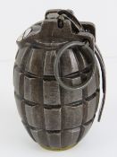 An inert Mills No5 Mk1 grenade, dated 19