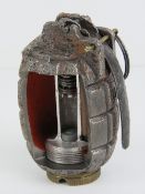 An inert Mills No5 grenade having cut-aw