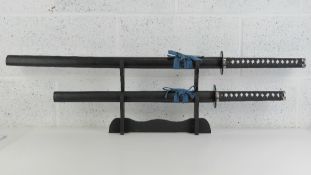 A pair of contemporary graduated katana