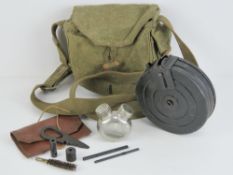 A WWII Russian PPSH-41 drum magazine in carry case, with cleaning kit and oil bottle.