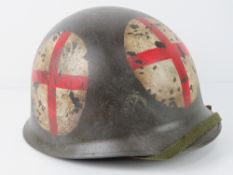 A reproduction US WWII medical helmet.