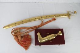 A decorative Arabic sword having gilt me