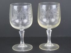 A pair of wine glasses having etched Cha