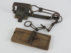 A vintage mole trap complete with tether