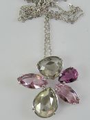 A Swarovski purple, grey and white cryst