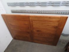 A pine kitchen table having removable le