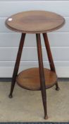 A circular tripod plater table, turned l