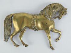 A large brass stable door plaque in the