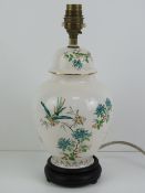 A ceramic lamp base in the style of a gi