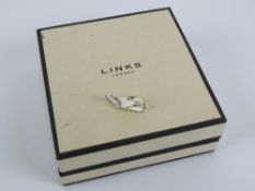 Links of London; a 925 silver charm in t