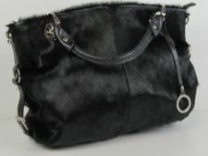 Edina Ronay; a black cowhide handbag approx 12 1/2