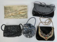 Two ladies beaded evening bags together with another in velvet having embroidery to front.