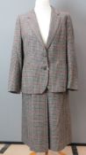 Burberry; A pure lambs wool ladies tweed suit jacket and skirt having suade elbow patches.