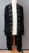 A three quarter length black velvet ladies jacket by Nicholas Courtney having sequined collar and