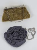 Two ladies evening bags one beaded gold colour the other purple floral.