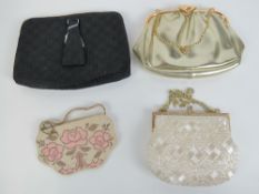 Two vintage ladies beaded evening bags together with two other evening bags. Four items.