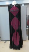 A floor length velvet cloak with hood having burgundy diamond pattern, 60