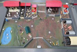 A superb hand built farm using Britain's farm parts, animals, gating and workers,