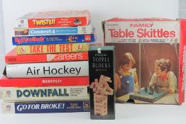 A quantity of assorted board games including Careers, Take the Test, Twister, Downfall,