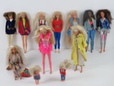 Two horse riding Barbies with jointed legs together with a long haired Barbie,