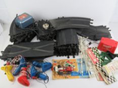 A large quantity of vintage Scalextric including transformer, track, racing car, etc.